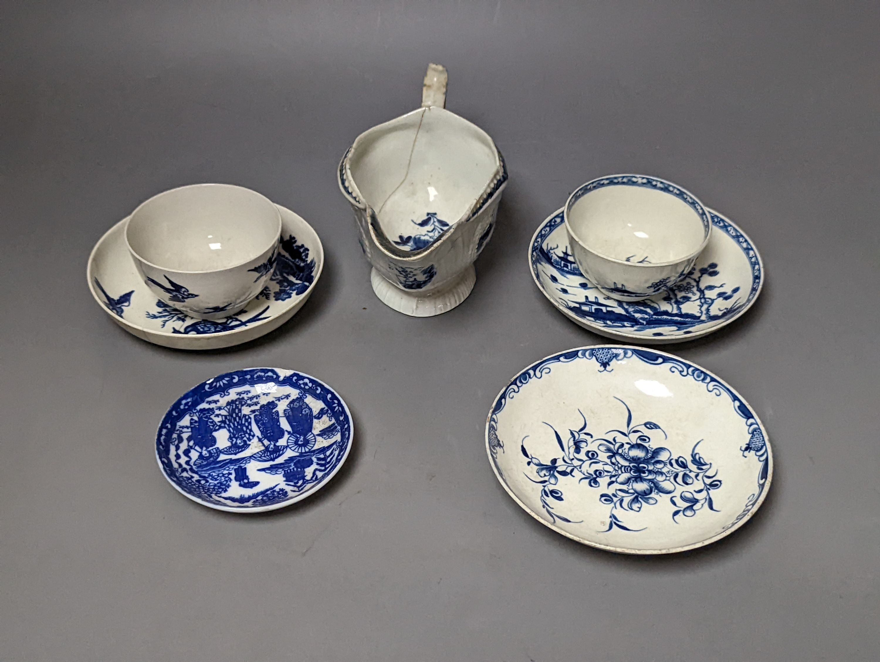 A Worcester blue and white sauceboat, two tea bowls and saucers, late 18th century and a Japanese single saucer. (7)